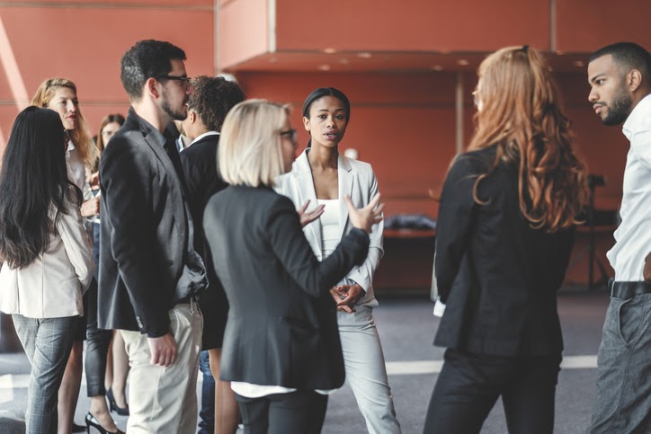 Photo of people taking in a group.